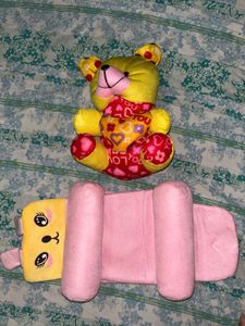 infant pillow and a teddy bear