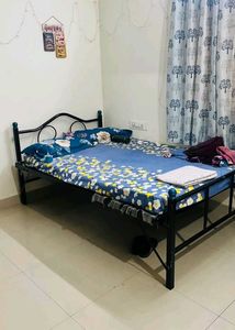 Single Metal Bed Frame with Blue Floral Bedding