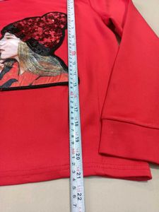 Chic Red Top with Sequin Embellishment