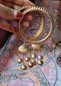 Elegant Gold-Tone Bangles with Tassel Charms
