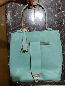 Chic Teal Handbag with Gold Accents