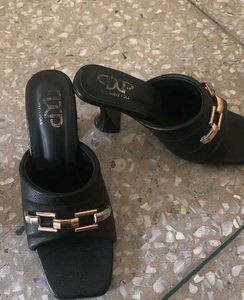Chic Black Mules with Gold Accent