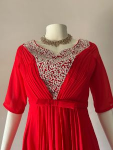 Elegant Red Gown with Embellished Neckline