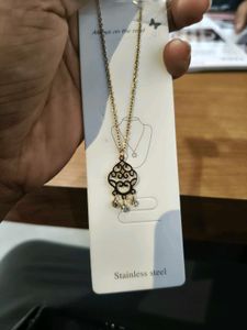 Elegant Gold Necklace with Black Pendant
