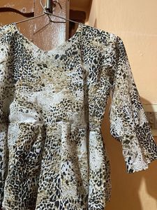 Chic Animal Print Peplum Top