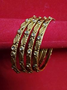 Elegant Gold Tone Bangles with Stones
