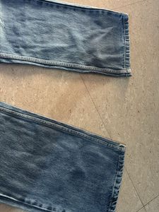 Distressed Blue Denim Jeans