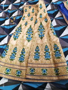 Beige Lehenga Choli with Blue Floral Embroidery