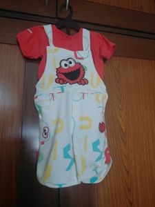 white dungaree with orange tshirt
