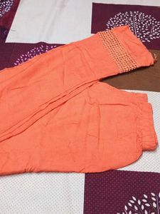 Orange Palazzo Pants length is 44"
