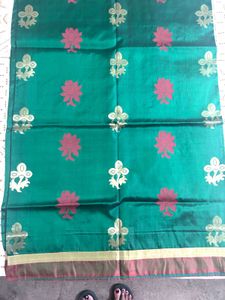 Elegant Teal Saree with Floral Motifs