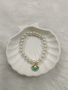 Elegant Pearl Bracelet with Shell Charm