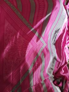 Vibrant Pink Saree with Intricate Pattern