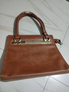 Chic Brown Handbag with Embellished Handle