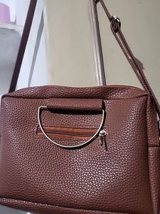 Sling Bag In Dark Brown Color Not Used New Item Very Spacious Have Multiple Sections