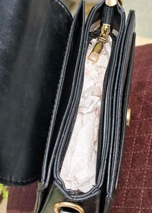 Chic Black Handbag with Gold Embellishment
