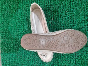 like new cream and golden belly shoe