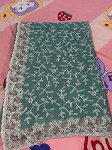 Elegant Embroidered Teal Saree