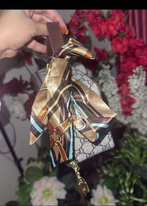Stylish Monogram Box Bag with Scarf Accent