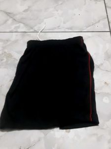Black athletic shorts with red trim