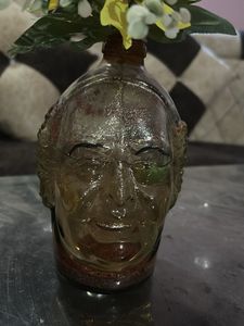 Unique Head-Shaped Vase with Yellow Flower