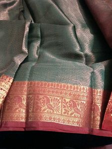 Elegant Teal Saree with Red Border