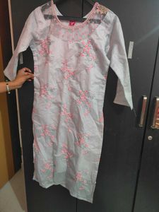 Embroidered organza kurti with net yoke.