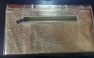 Beautiful golden Clutch with a bronze buckle