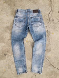Distressed Blue Denim Jeans