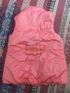 pink quilted sleeveless vest.