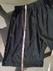 Tonal black side stripe shorts.