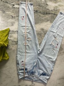 Ripped Jeans with Floral Embroidery