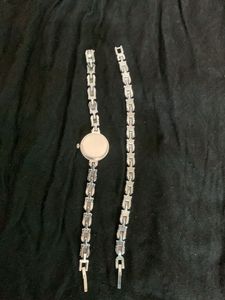 Elegant Silver Watch with Blue Stones