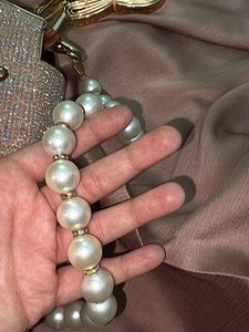 Shimmery Handbag with pearl chain