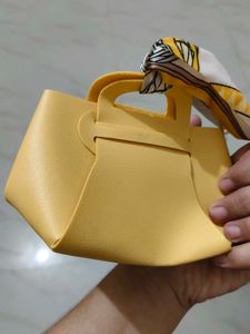Chic Light Blue Handbag with Scarf Detail