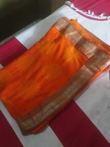 Orange Saree with Floral Motifs