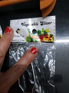 2 Stainless Steel Vegetable Slicers and ravi