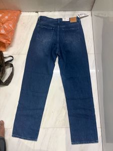 Distressed Blue Denim Jeans