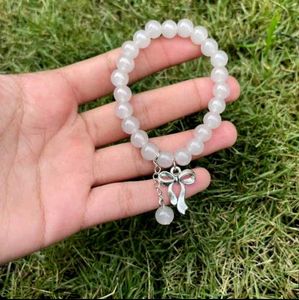 pair ribbon Beaded Charm Bracelets