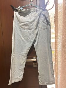Ripped Wide Leg Jeans with Daisy Patch