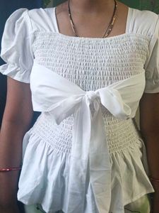 Chic White Smocked Crop Top with Bow Detail
