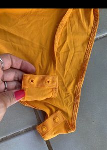 Orange Ruched One-Shoulder Bodysuit