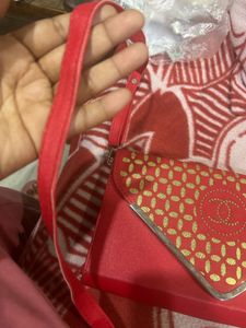 Red Sling Bag With CHANEL Logo