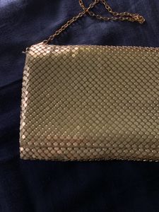 Gold metal mesh clutch