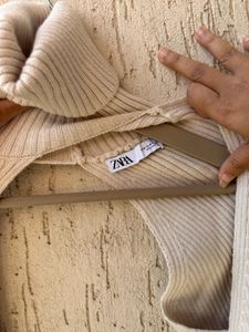 Cream Ribbed Turtleneck Sweater Arms