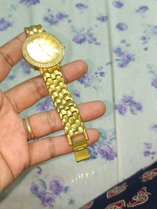 Elegant Gold Tone Watch with Crystal Accents