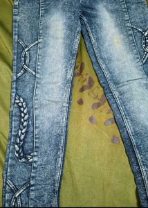 Stylish Blue Wash Jeans with Unique Detailing