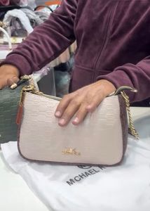michael kors sling bag with tag and branding