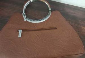 Chic Brown Handbag with Ring Handle