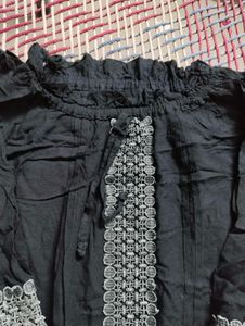 black top and  grey pant